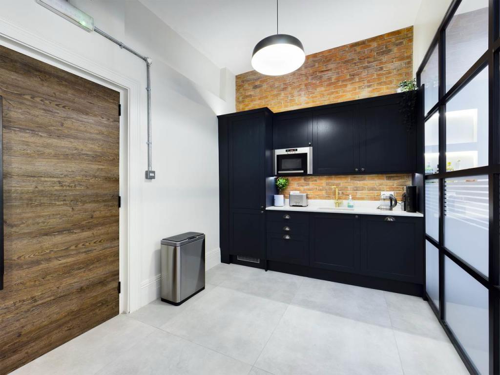 Kitchen area with bespoke timber door and Crittall screen